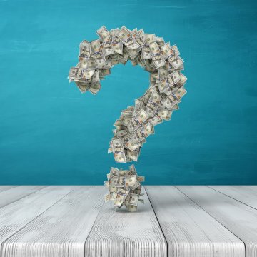 efax online fax service price cost question mark made of dollar bills blue background wooden floor